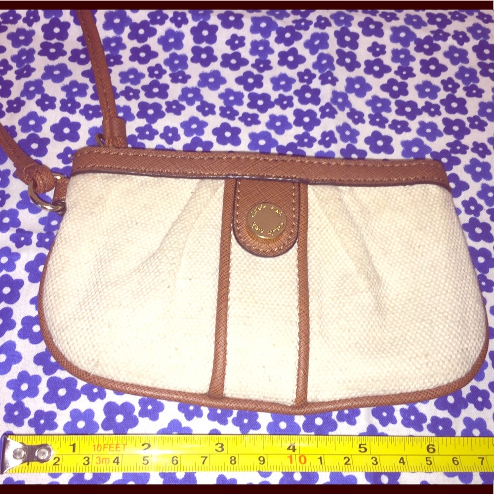 Calvin Klein’s canvas wristlet w faux leather trim